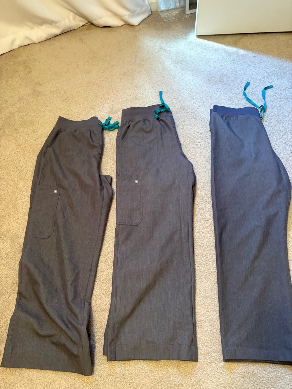 Set of Three Gray Drawstring Scrub Pants with Teal Ties

Figs